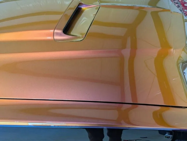Candy paint hood and scoop buffed to a mirror by Grindtime Mobile Detailing