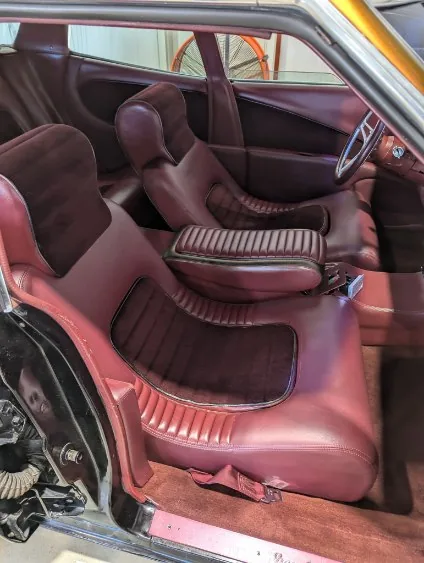 Burgundy custom bucket seats detailed by Grindtime Mobile Detailing