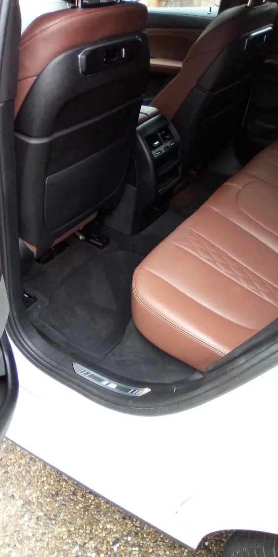 BMW rear seats in cognac leather detailed by Grindtime Mobile Detailing